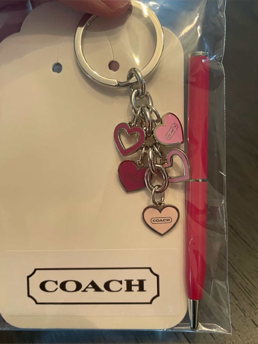 Coach pink heart charm keychain and matching pink pen set